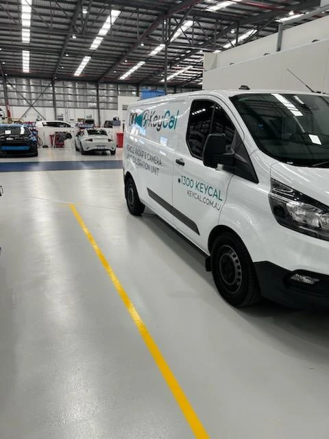KeyCAL mobile service van parked inside vehicle repair workshop in Perth