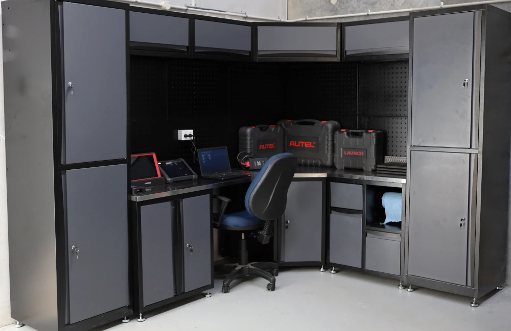 Workstation with diagnostic tools including Autel and Launch branded devices