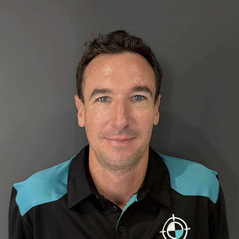 KeyCAL ADAS technician wearing black and teal uniform
